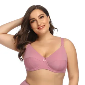 Plus size smooth wireless bra for women, comfortable daily wear pink shaping undergarment detail.