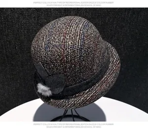 Detailed view of the women retro tweed cloche hat with cute side bow and fluffy fur ball accent.