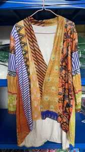 Boho chic printed cardigan with unique patchwork design, loose fit long sleeve casual cover up.