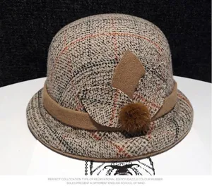 Classic women's winter plaid cloche hat with stylish brown leaf trim and retro British style.