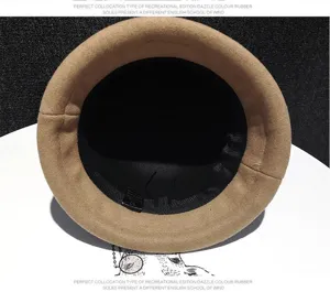 Detailed view of women's autumn winter wool bucket hat, beige felt cap with inner lining.
