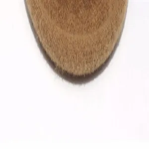 Close-up detail shot of the soft wool texture and curved edge of the stylish women's hat.