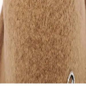 Close-up detail of camel wool felt fabric material with metallic hardware decoration.