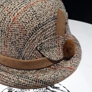 Classic autumn winter women retro plaid cloche hat with suede band and cute pom pom detail.