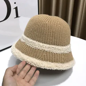 Cozy brown knitted bucket hat with plush fleece trim, thick warm winter headwear style.