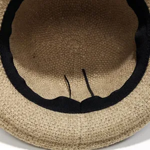 Classic woven sun hat interior view with breathable material, black sweatband and adjustable drawstrings.