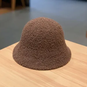 Brown fuzzy bucket hat detail view, soft textured wool blend fabric for autumn winter daily wear.
