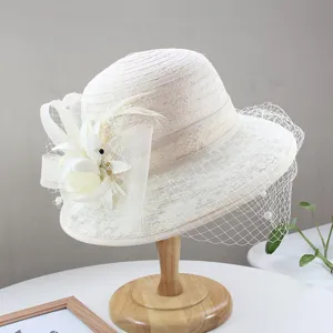 Vintage beige women lace bucket hat featuring elegant net veil and floral feather detail.