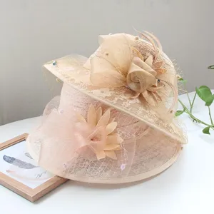 Detailed view of vintage mesh lace sun hat with floral decor, elegant beige design.