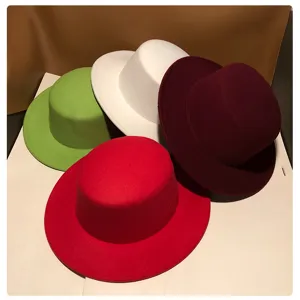 Detailed view of colorful autumn winter flat top felt hats, vintage wool fashion bowler hats.