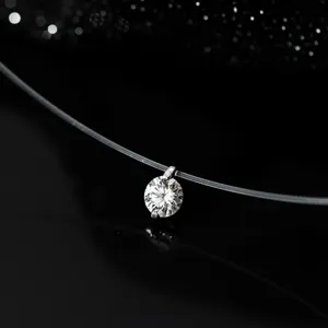 Exquisite 1-carat moissanite solitaire pendant necklace on clear fishing line detail shot.
