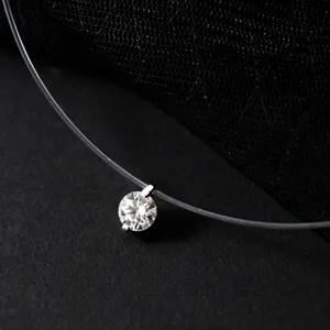 Detailed close-up of a sparkling 1 carat solitaire moissanite pendant on invisible line.