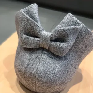 Grey knit wool bucket hat detail, warm winter basin hat with a cute bow at the back.