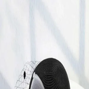 Detailed view of an elegant black woven mesh flower bowler hat, perfect for summer British style.