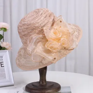 Detail view of elegant women lace sun hat, featuring floral organza bow and breathable summer mesh.