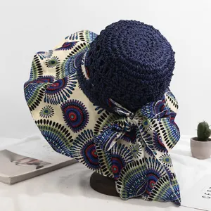 Chapeau de soleil femme large bord plage chapeau de paille avec nœud en tissu.