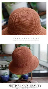 Close-up detail of the stylish brown knitted bucket hat, showing fine texture and foldable design.