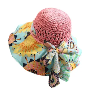 Chapeau de soleil d'ete pour femme avec couronne en paille et large bord imprime avec noeud.