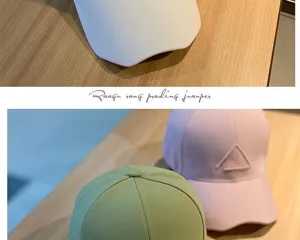 Detailed close-up view of fashionable baseball caps in multiple colors featuring chic embroidery.