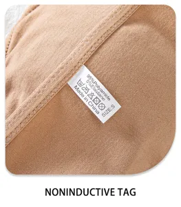Strapless bra detail shot showing seamless fabric and wash tag, size S, nude color.