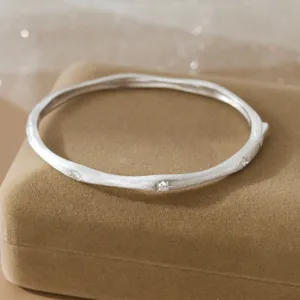Vintage silver brushed star bangle detail, matte finish cuff bracelet with sparkling cubic zirconia.