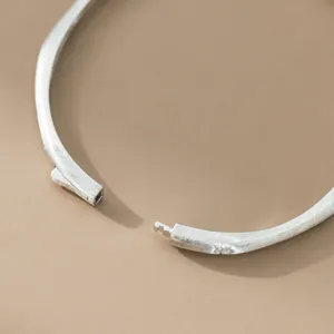 Silver brushed star bangle detail shot, vintage style open cuff bracelet with sparkling stone.