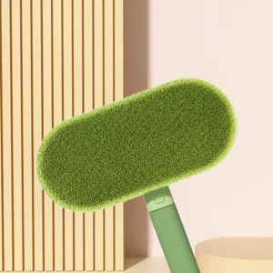 Vue détaillée de la brosse à poils d'animaux avec tête verte et dimensions pour meubles.
