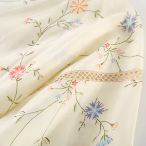 Exquisite floral embroidery detail on soft cotton gauze fabric for comfortable loungewear.
