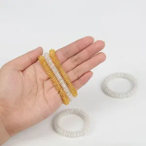 Bracelet de massage de décompression à ressort en métal or et argent, jouet anti-stress.
