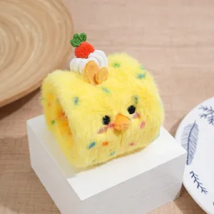 Cute yellow swiss roll plush cat toy close up showing soft fabric and adorable chick face.