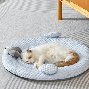 Comfortable round pet bed for cats and dogs, soft blue textured cushion with cozy raised edge.