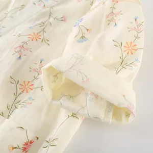 Detailed view of women's cotton gauze floral kimono robe, soft fabric and delicate print texture.