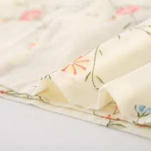 Soft cotton gauze sleepwear fabric detail, featuring cute floral print and breathable texture.