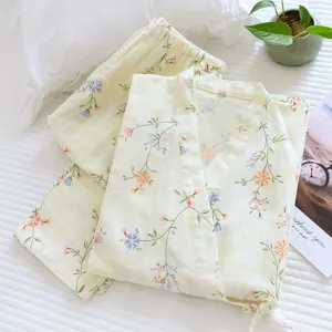 Cotton floral kimono pajama set detail, soft loungewear with wrap front and matching pants.