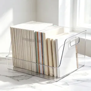 Close-up view of a clear acrylic desktop book organizer, showing neat storage of books and booklets.