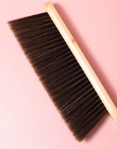 Wooden bed cleaning brush with soft bristles for household dusting, furniture and bed cleanup.