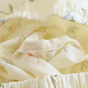 Detailed view of women's floral cotton pajama elastic waistband and inner fabric label craftsmanship.
