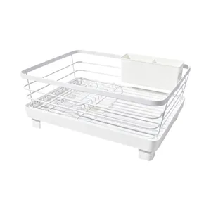White metal wire dish drying rack with plastic tray and utensil holder for kitchen counter.