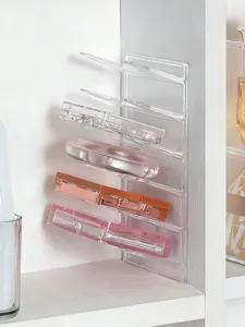 Clear acrylic eyeshadow palette organizer with multiple partitioned slots for makeup storage.