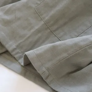 Grigio cotone lino pigiama tessuto dettaglio scatto, comodo homewear texture primo piano.