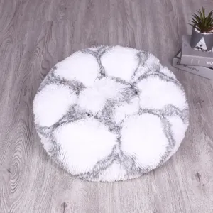 Round fluffy pet bed in white and grey long plush, warm and cozy sleeping nest for cats and dogs.