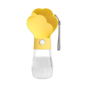 Portable pet water bottle for dogs and cats featuring paw-shaped bowl and hand strap.