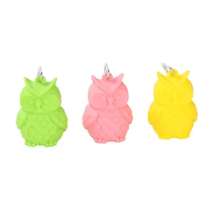 Silicone owl poop bag dispenser detail with green, pink, and yellow holders and metal hooks.