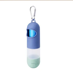 Portable pet waste bag dispenser detail view, capsule design with carabiner and rolls.