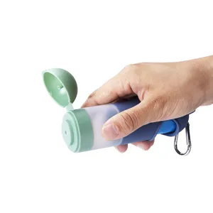 Portable pet waste bag dispenser detail showcasing the open lid and silicone holder design.