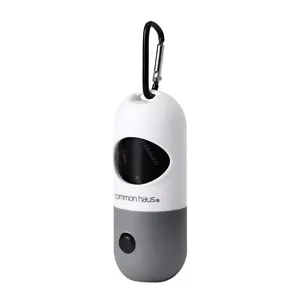 Portable pill shaped dog poop bag dispenser with hanging carabiner for pet waste cleanup