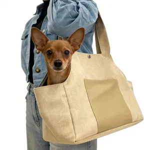 Canvas pet carrier bag detail, portable shoulder tote for small dogs and cats outdoors.
