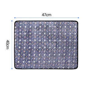 Detail view of pet mat showing soft star pattern fabric and durable black stitched edges.