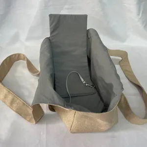 Detail view of breathable pet carrier bag with cooling interior lining and secure safety tether strap.