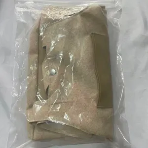 Detail view of the khaki pet carrier bag folded neatly inside a transparent protective package.